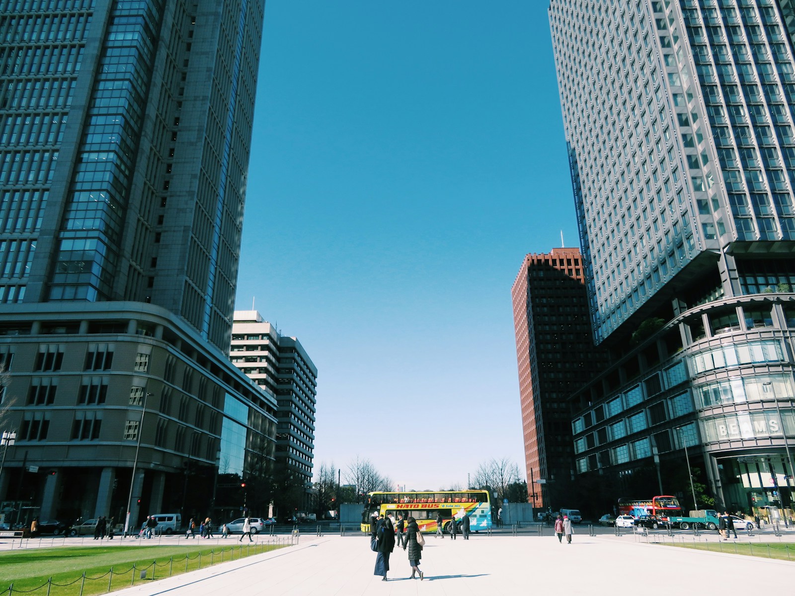 a couple of people standing in the middle of a street